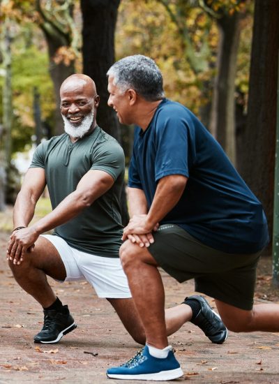 Senior, man group and stretching at outdoor together for elderly fitness or urban wellness for happiness. Happy retirement, friends workout or exercise club in diversity, teamwork or health lunges
